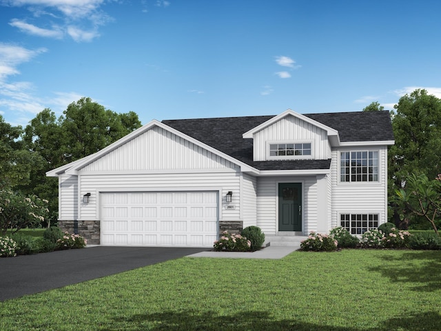 view of front of house with a front lawn and a garage