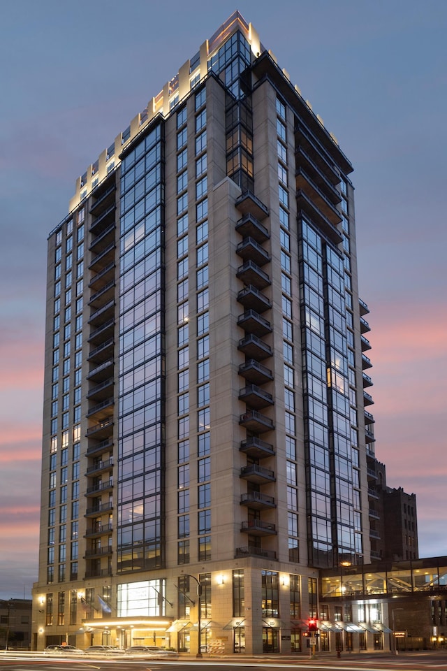 view of outdoor building at dusk