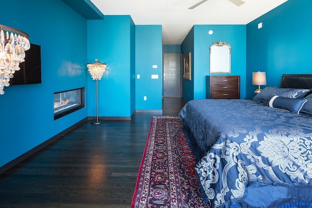 bedroom featuring hardwood / wood-style flooring and ceiling fan