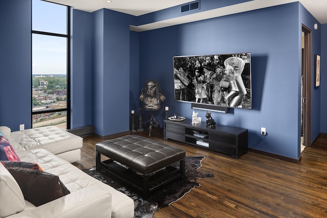 living room with dark hardwood / wood-style flooring