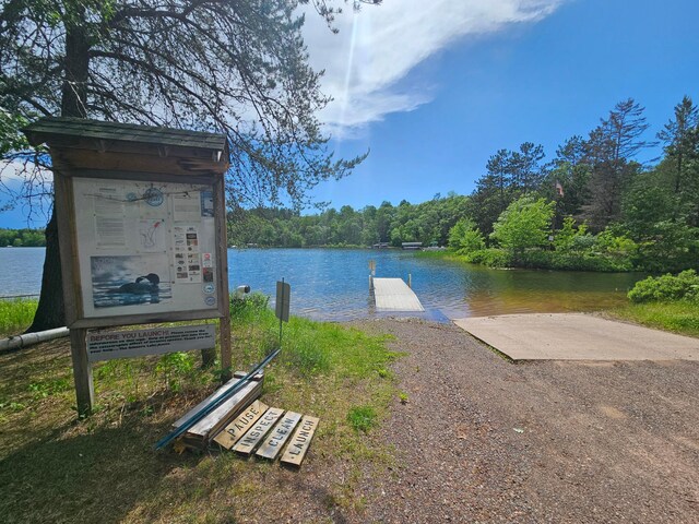 property view of water with a dock