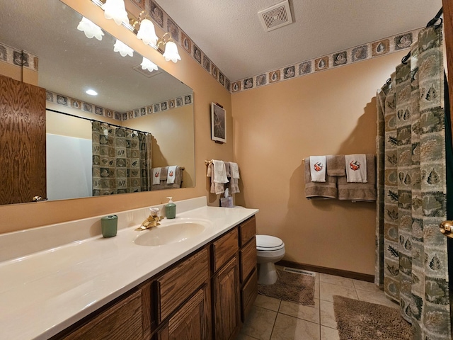 bathroom with tile patterned flooring, a textured ceiling, toilet, vanity, and a shower with shower curtain