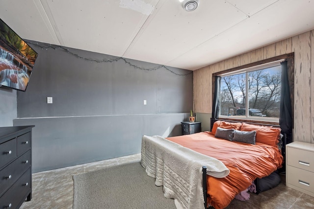 bedroom featuring concrete floors