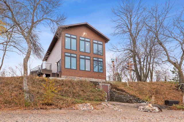 view of side of home featuring a deck