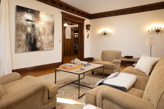 living room with light wood-type flooring and crown molding