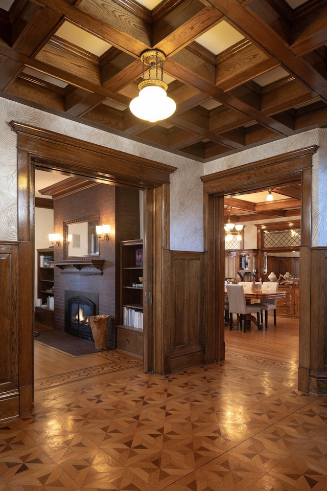 interior space featuring wood walls, parquet floors, and ornamental molding