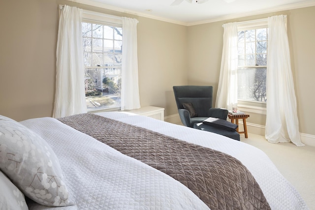 carpeted bedroom featuring ceiling fan, crown molding, and multiple windows