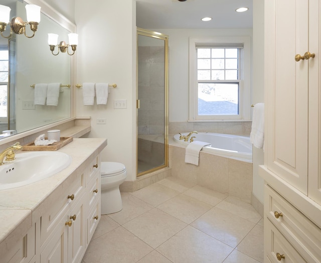 full bathroom with tile patterned flooring, vanity, separate shower and tub, and toilet