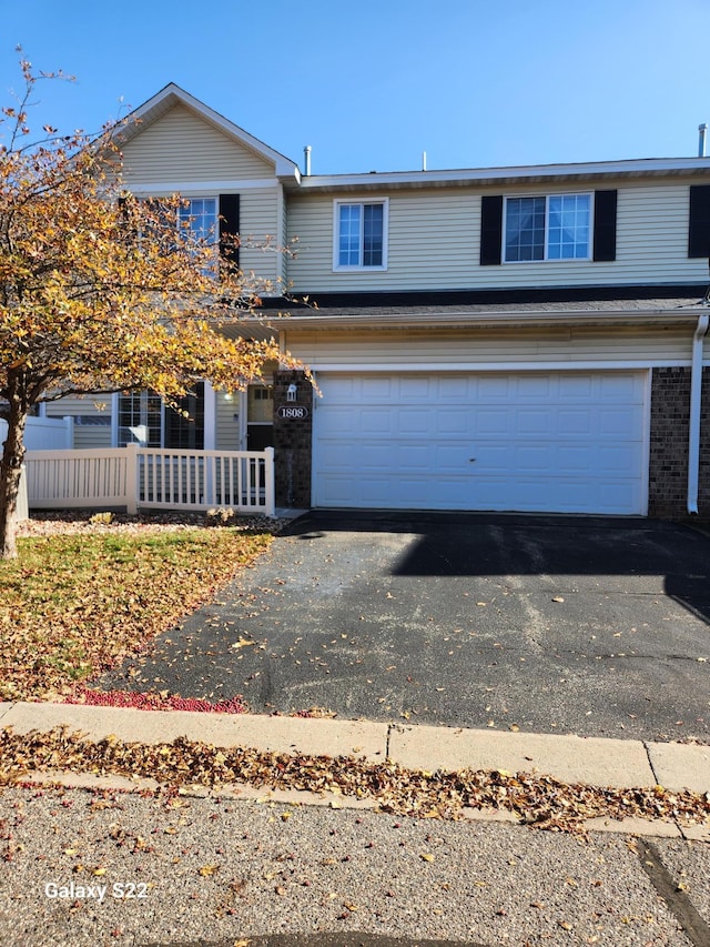 front of property with a garage