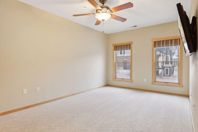 empty room featuring carpet and ceiling fan