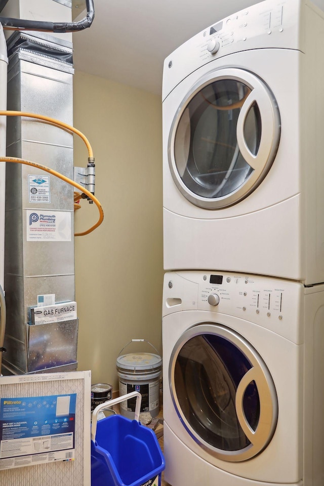 washroom with stacked washer and dryer