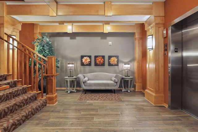 living room with elevator and hardwood / wood-style flooring