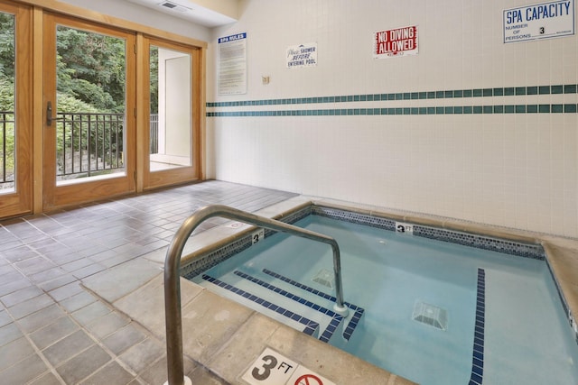 view of pool featuring an indoor hot tub