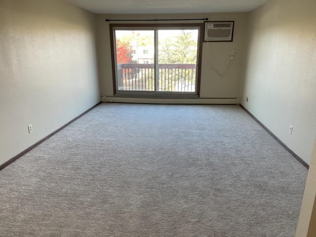 carpeted empty room with a wall mounted AC and a baseboard radiator