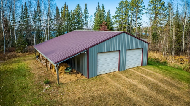 garage featuring a yard