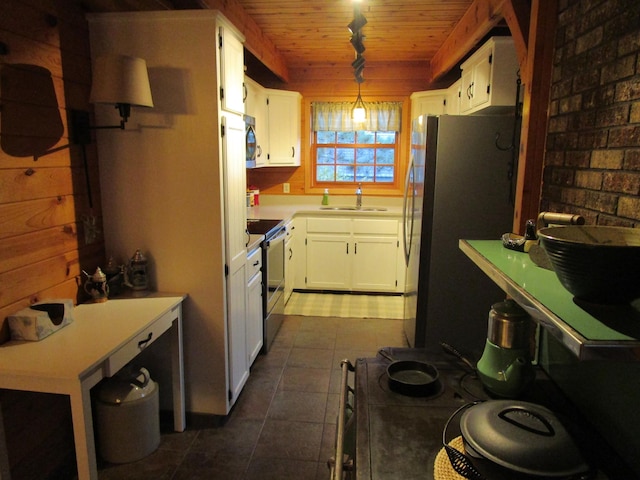 kitchen with sink, stainless steel appliances, pendant lighting, white cabinets, and wood ceiling