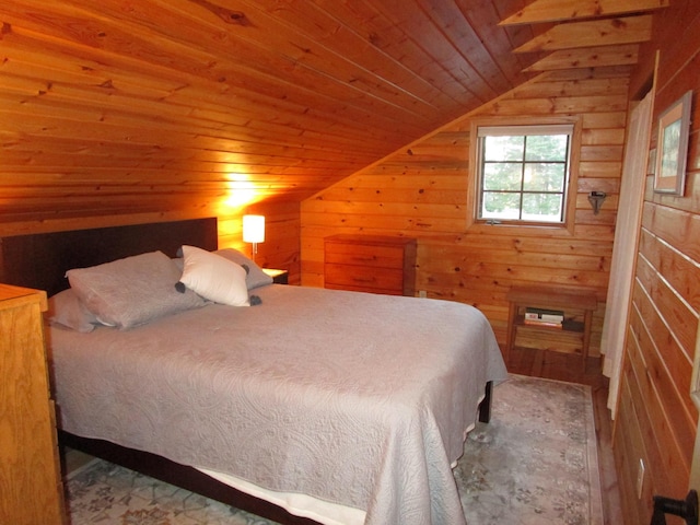 bedroom with wooden walls, wooden ceiling, and vaulted ceiling