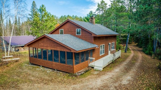 view of front facade featuring a sunroom