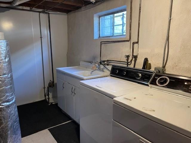 laundry area featuring sink and washer and clothes dryer