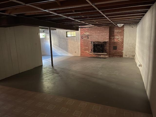 basement with a brick fireplace