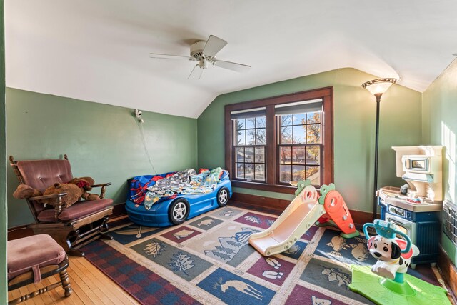 bedroom with wood-type flooring, ceiling fan, and lofted ceiling