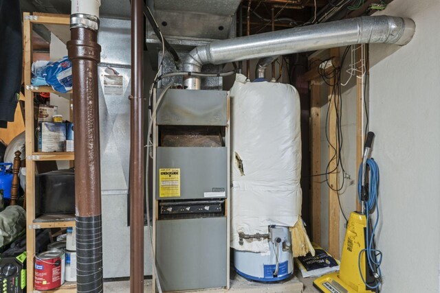 utility room with water heater