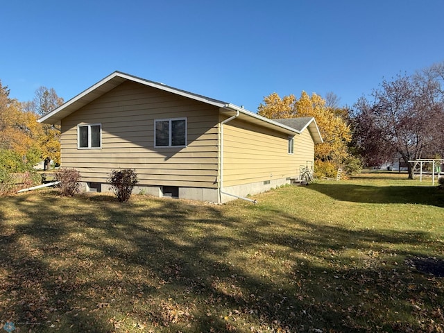 view of property exterior featuring a lawn