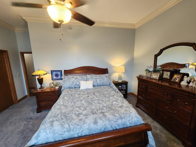 bedroom with dark carpet, ornamental molding, baseboards, and a ceiling fan