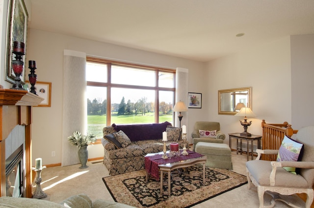 living room featuring carpet and a tiled fireplace