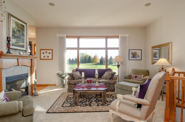 living room featuring carpet and a fireplace