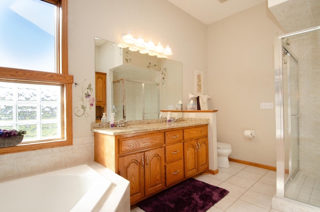 full bathroom featuring vanity, shower with separate bathtub, and toilet