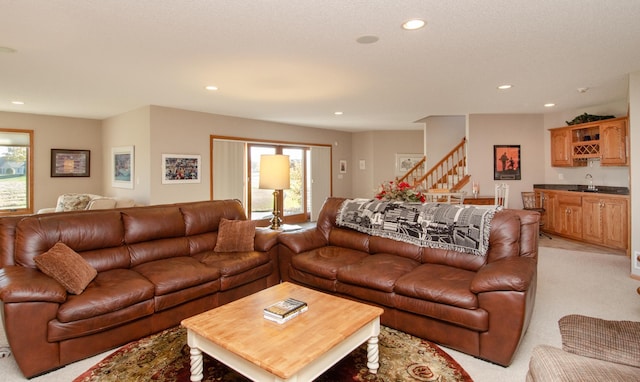 carpeted living room with bar area