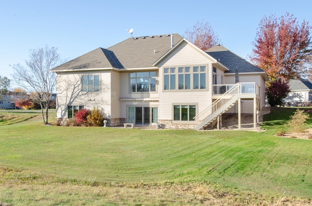 back of house with a deck and a lawn