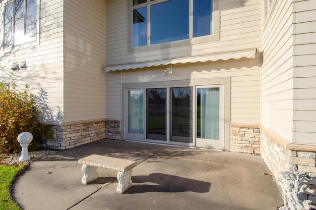 entrance to property with a patio