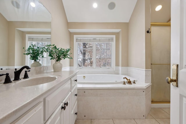 bathroom with vanity, tile patterned flooring, and a healthy amount of sunlight