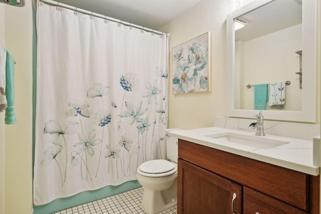 bathroom with toilet, tile patterned flooring, walk in shower, and vanity