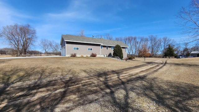 back of property featuring a lawn