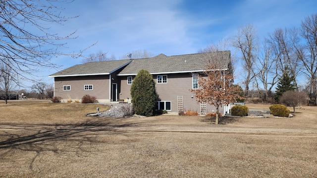 rear view of house with a yard