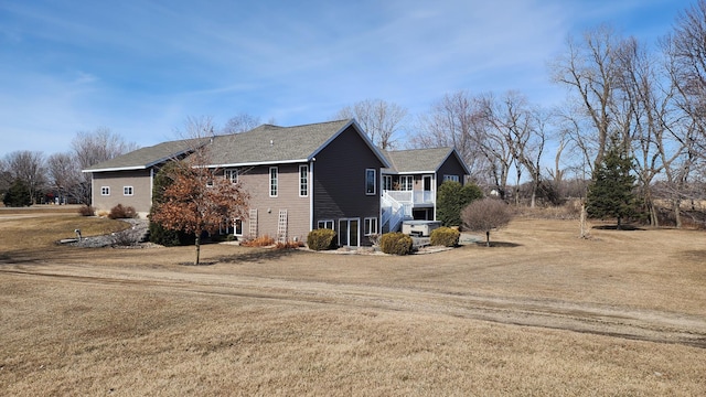 view of side of property featuring a yard