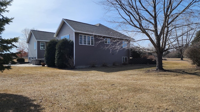 view of home's exterior with a yard