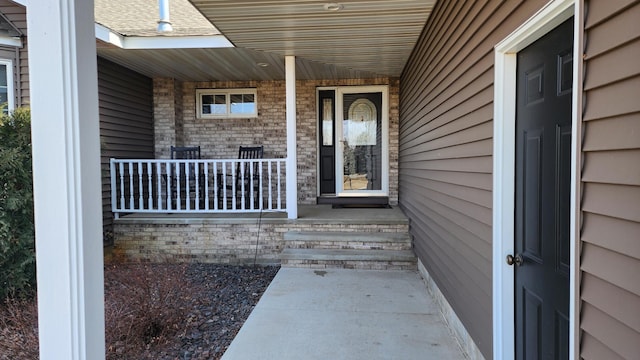 doorway to property with a porch