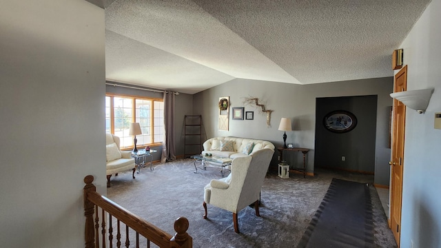 carpeted living room featuring a textured ceiling and lofted ceiling