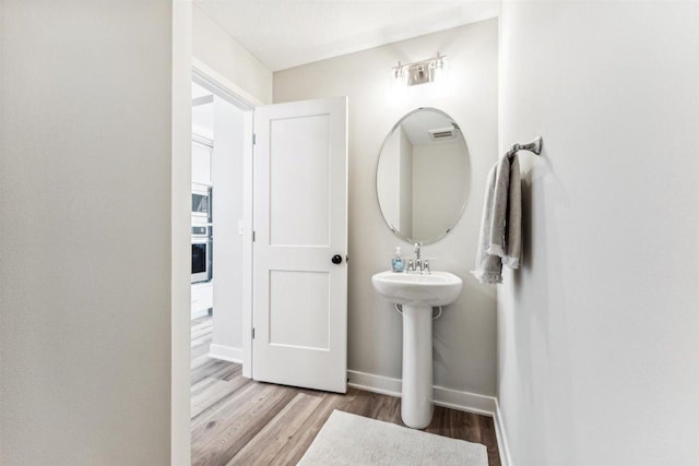 bathroom featuring hardwood / wood-style floors and sink