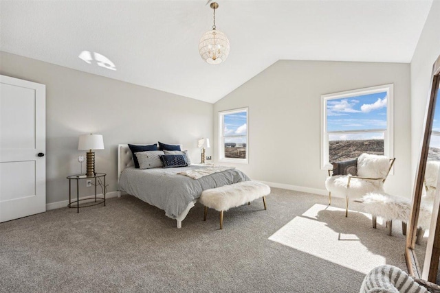 carpeted bedroom featuring vaulted ceiling and a notable chandelier