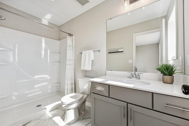 bathroom with curtained shower, vanity, and toilet