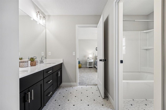 bathroom featuring vanity and a textured ceiling