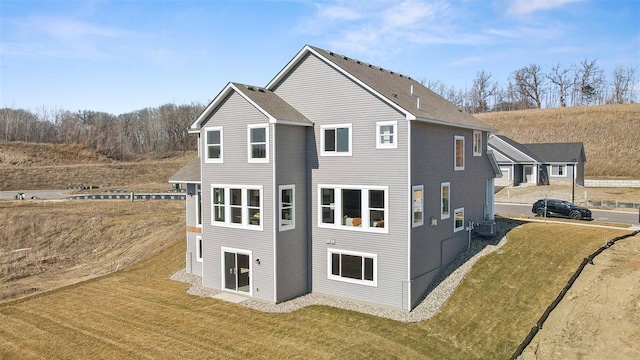 rear view of house with a lawn