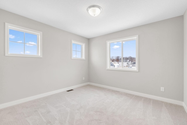 15701 Aquila Ave, Savage, MN 55378 - unfurnished room featuring carpet flooring, baseboards, and visible vents