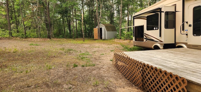 view of yard with a storage shed