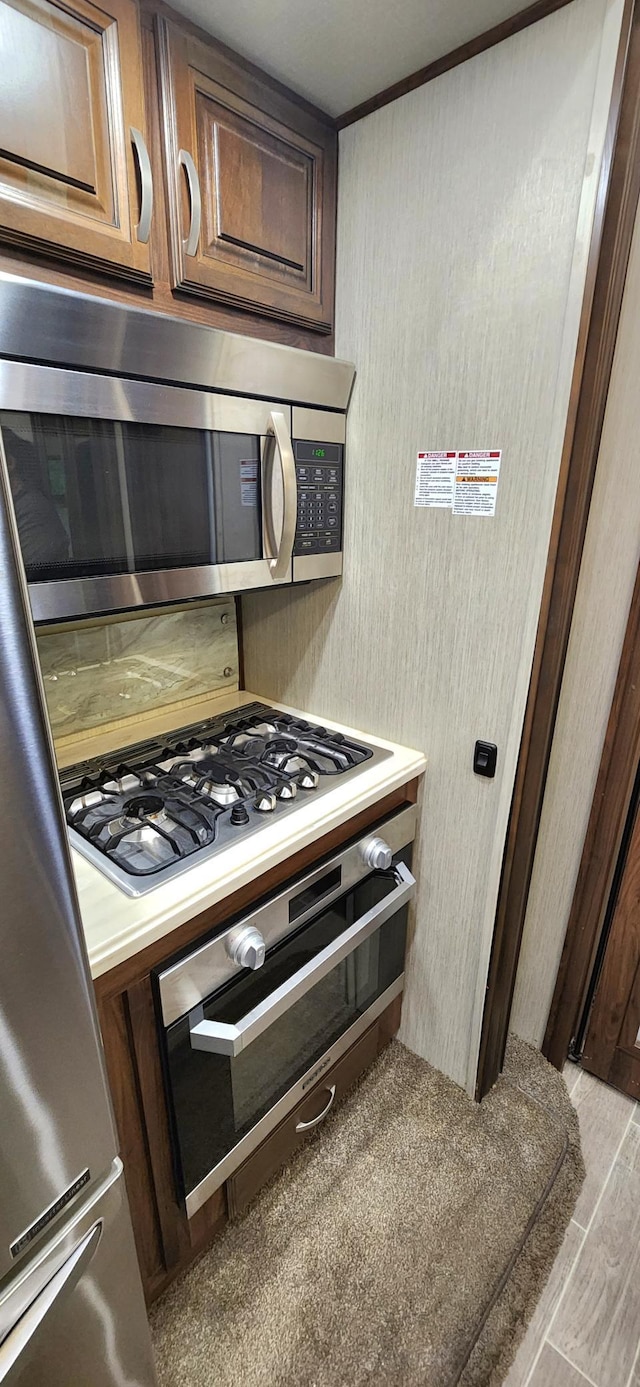 3736 Silent Springs Ct, Webb Lake, WI 54830 - interior details featuring light wood-type flooring, stainless steel appliances, and light countertops